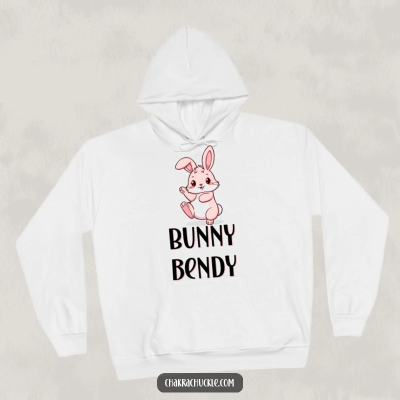 Funny pink bunny hoodie in an impressive pretzel pose with one leg reaching skyward, perfect for cozy relaxation.