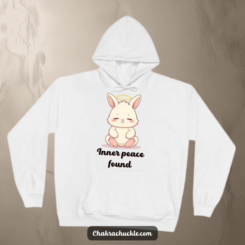 Funny, warm hoodie depicting a fluffy bunny in a tranquil lotus pose, eyes closed, with a small, divine halo.