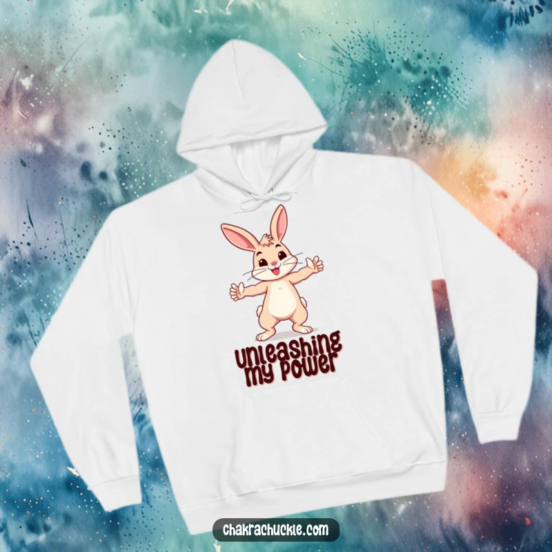 Funny bouncing bunny practicing a playful warrior pose, arms outstretched, on a warm hoodie.