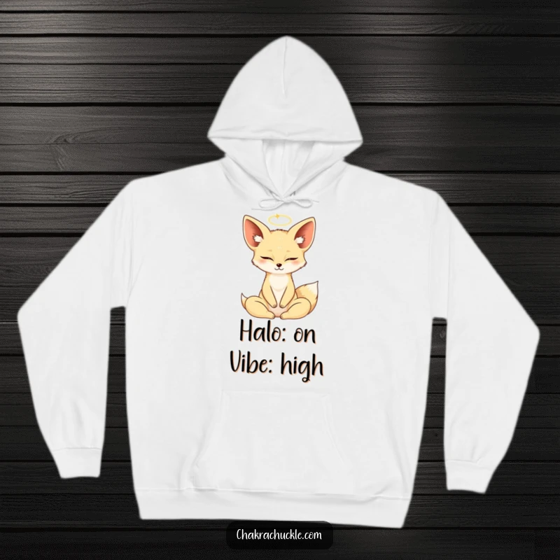 Cozy funny Fennec Fox wearing a yoga lotus pose, eyes closed, halo, on a warm hoodie.