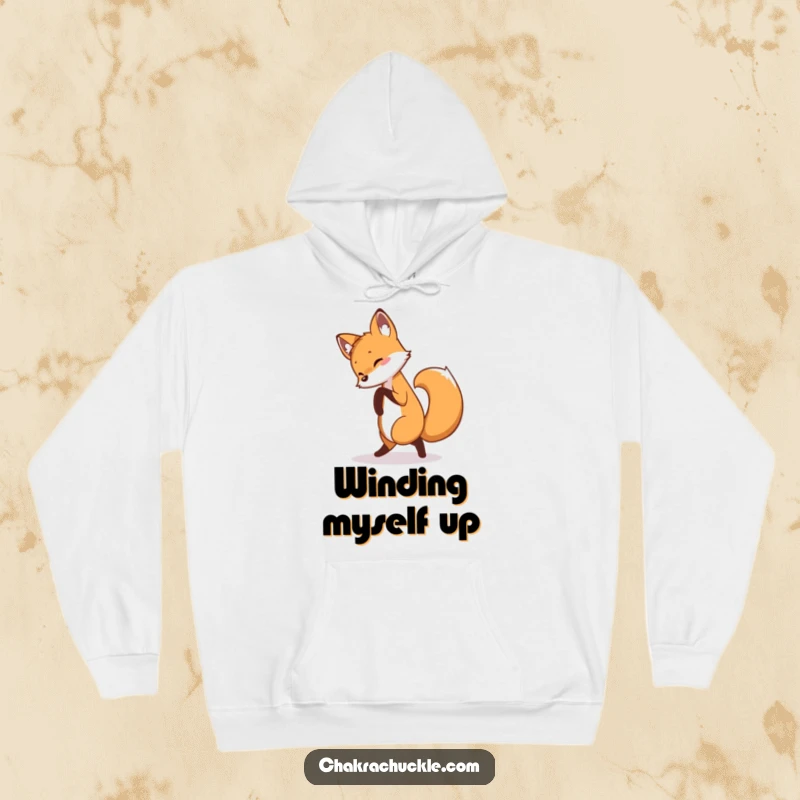 Funny fox hoodie featuring a curious fox playfully chasing its tail in a pretzel pose, designed for maximum comfort and humor.