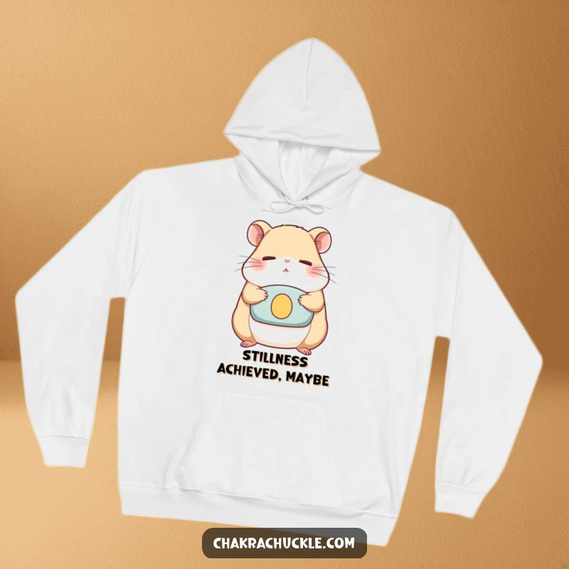 Funny Hoodie depicting a serene hamster meditating on a cushion, eyes closed, radiating peaceful vibes and humorous calm.