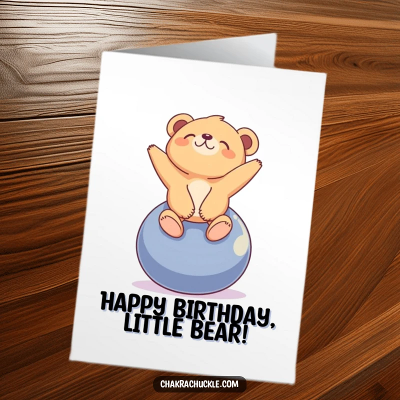 Funny Free Printable Birthday Card: A tiny bear cub balancing serenely on a yoga ball, looking blissfully upwards.