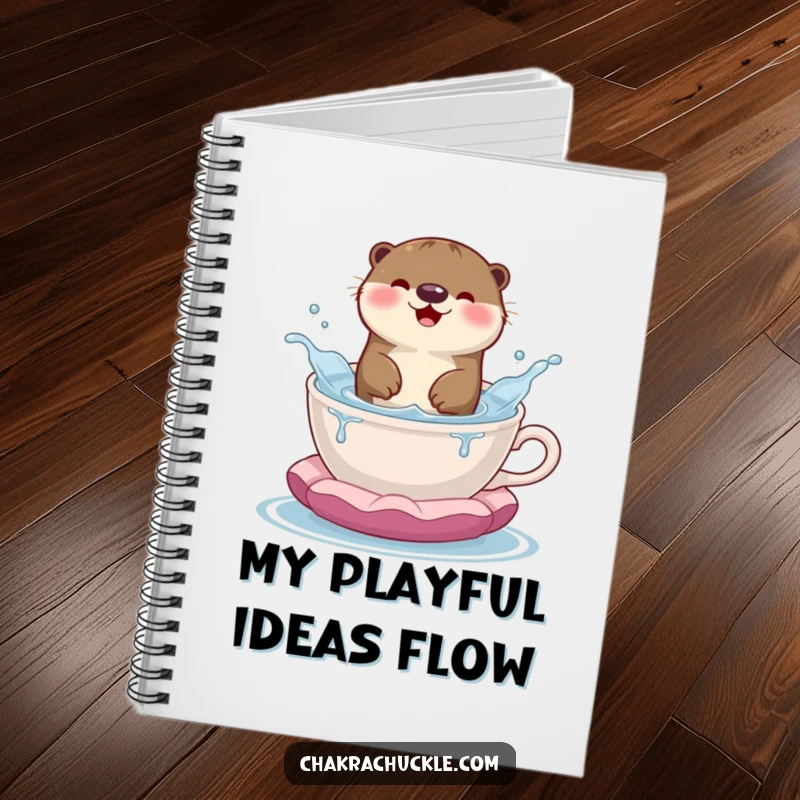 Funny notebook featuring a happy otter splashing playfully in a teacup meditation cushion, inspiring creative and fun entries.