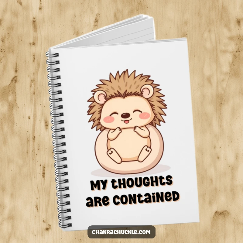 Funny notebook cover featuring a happy hedgehog meditating, rolled into a ball, for humorous and peaceful note-taking.